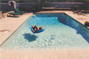person floating in pool